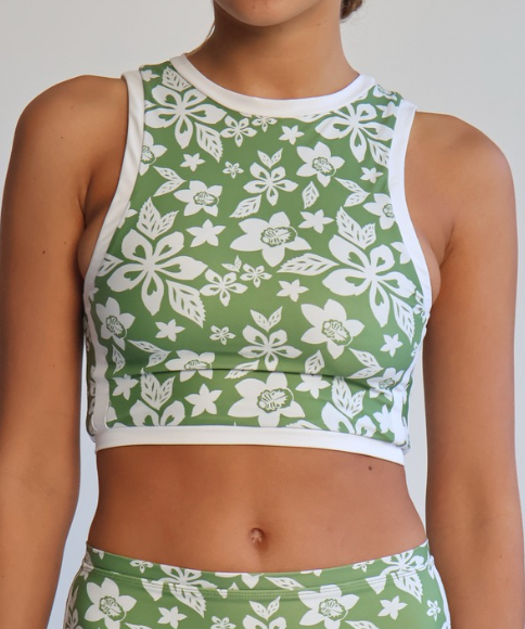 Green and white floral sports outfit on a plain background